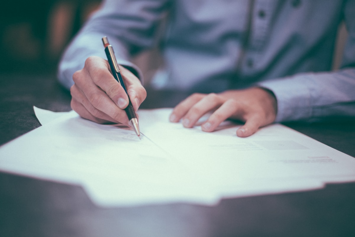 Executive reviewing and signing corporate incorporation documents